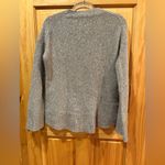 Theory knit crewneck sweater in various shades of brown and beige. Photo 1