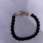 Black and Pink Beaded Bracelet with Silver Charm Photo 1