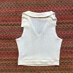 WHITE KNIT COLLARED SLEEVELESS POLO Photo 1