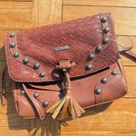 Miss Me Brown Clutch with Tassel and Stud Accents Photo 0