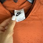 Nike Icon Clash all over logo print mock-neck long sleeve top in terracota Photo 3