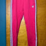 Adidas Red Track Pants with White Stripes Photo 0