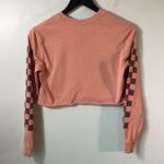 Vans  XS long sleeve crop top logo shirt on peachy tone. Photo 5