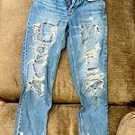 Really ripped jeans! Lol. Both legs ripped up but stylish. Blue Size 2 Photo 0