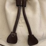 Dooney & Bourke Vintage  Leather Drawstring Bucket Bag in Bone color Brown Trim a Photo 2