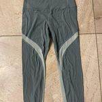 Athleta Small Green Salutation Stash Pocket 7/8 Tight legging women's medium Photo 0