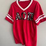 Augusta Sportswear Alpha Omicron Pi V Neck Floral Letters Tee Photo 0