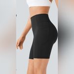 Halara  UltraSculpt High Waisted Scrunch Butt Pocket Biker Shorts 7'', size large Photo 1