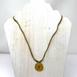 Mayan design gold tone pendant purchased in Costa Rica, on golden suede cord Photo 4