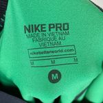 Nike Pro Dri-Fit Black & Green Geometric Sunburst Leggings Photo 5