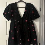 ASOS DESIGN embroidered tiered smock playsuit in black Size 0 Photo 3