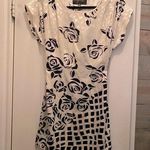 Super cute silky cream and black cocktail dress! Size XS Photo 0