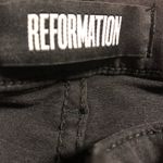 Reformation ❤️  black skinny jeans with knee rips Photo 2