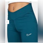 Nike ‎ Pants Blue Tight Fit Mid Rise Pull On Flare Slit Legging Size Medium Yoga Photo 1