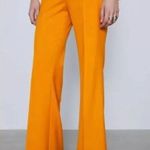 ZARA NWT Pants Women’s Size XS Mid Rise Flared Flat Front Orange Yellow Trousers Photo 1