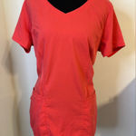 Grey's Anatomy V-Neck Short Sleeve scrub Top in Coral/orangish. Size Medium. Photo 0