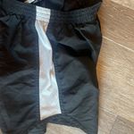 None Black and white athletic running shorts Photo 4