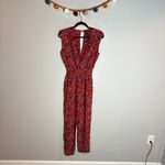 AQUA  Womens Leopard Print Surplice Jumpsuit In Red Photo 1