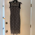 Monique Lhuillier ML
Ivory Lace Sheath Photo 2