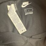 Nike  Women's Black All Over Swoosh Logo Leggings Pants Size Small Photo 2