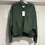 Calvin Klein NWT  Jeans Women's Cutout V Neck Cardigan Green Size  S/P. Photo 3