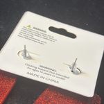 Halloween pierced adorable lips with two fangs. The red on the lips are sparkly. Photo 2