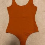 Shinestar Orange Bodysuit Photo 0