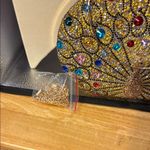 Gold and Red Ornate Clutch with Gemstone Embellishments Photo 3