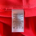 Alo Yoga Alo Mid Rise Stash Pocket Leggings in Bright Coral Size Small Photo 3