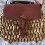 Woven purse with brown leather and gold accents Photo 1