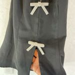 Chic Black Backless Dress with White Bow Details Photo 2