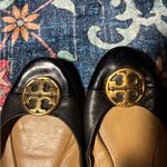 Tory Burch Black and Tan flats with Gold Emblem Photo 7
