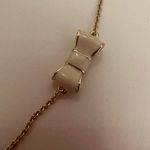 Kate Spade New York Take a Bow Gold and White Enamel Bow Scatter Chain Necklace Photo 7
