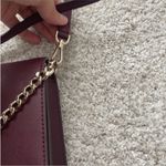 Kate Spade  Maroon Crossbody Bag with Gold Chain Strap. Photo 5