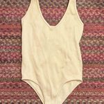 Aura  CREAM NUDE RIBBED SEAMLESS TANK CHEEKY BODYSUIT Photo 0