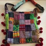 PATCHWORK BOHO SLING STYLE CROSSBODY COLORED PATCHES WITH RED BALL TASSELS Photo 0