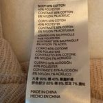 Free People  “swit the small stuff “ mock turtleneck in cream. Size large Photo 7