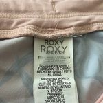 Roxy Pink and blue shorts, drawstring waist, excellent condition, size small Measurements: Waist: side to side 13-14 inches Rise: 9 inches Inseam: 2 inches Photo 5