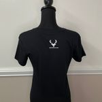 Next Level Apparel Bucked Up Black Short Sleeve Tee with Green Logo Photo 2