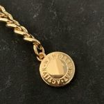 We Wore What  black biker shorts with gold chain belt Photo 1