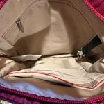 Travelon Anti-Theft Classic Mini Shoulder Bag in the Berry Tulip color Photo 5
