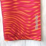Reebok 🆕 Skinny Orange Wave Capris Photo 2