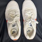 Nike Cream and Orange Sneakers Photo 1
