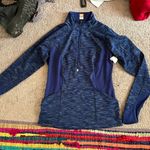 Lucy Activewear Blue half zip long sleeve top with thumb holes and arm zip pocket Photo 1