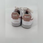 Nike  White and Pink Athletic Shoes with Breathable Design Photo 1
