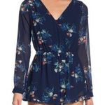 Japna NWOT Revolve  Blue Floral splice ruffle hem Romper. Size Small Photo 0