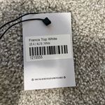 Princess Polly White cropped tank, with floral sleeves and white embroidered print. It is brand new never worn. NWT Photo 3