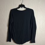Nike long sleeve black tee with a silver/gold logo size small Photo 3