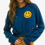 Aviator Nation x SoulCycle cropped crew sweatshirt Medium Blue smiley graphic Photo 0