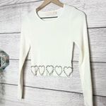 White Ribbed Long Sleeve Crop Top with Rhinestone Heart Detailing Size Medium Photo 2